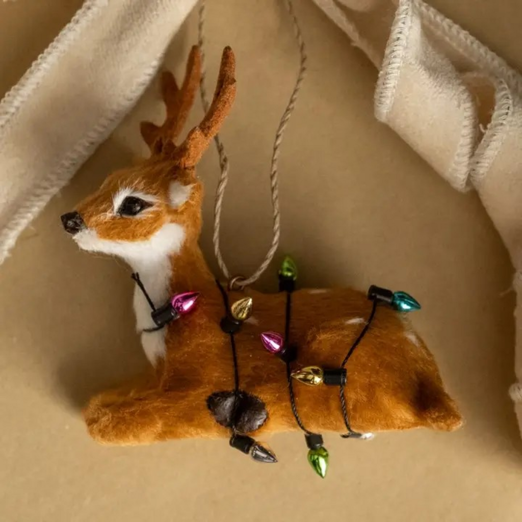 resting festive fur deer ornament