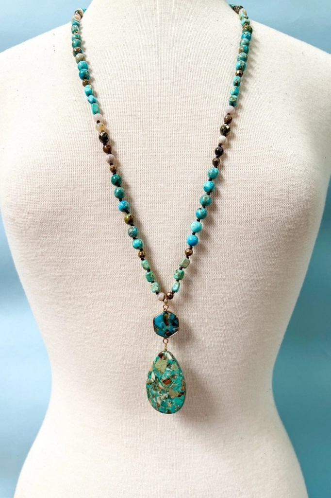 long turquoise necklace with large charm