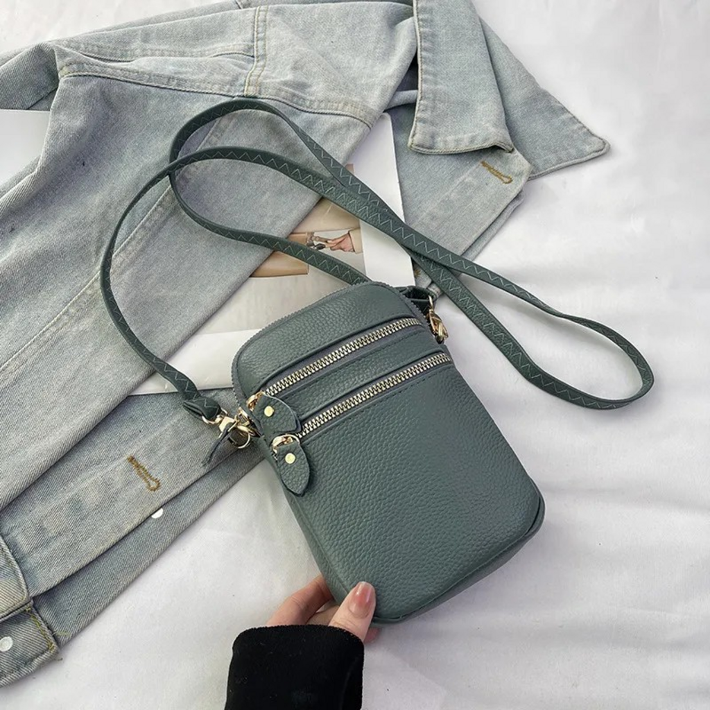 blue cross body leather handbag