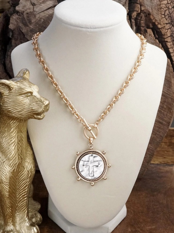 worn gold cross coin chain necklace with front toggle closure