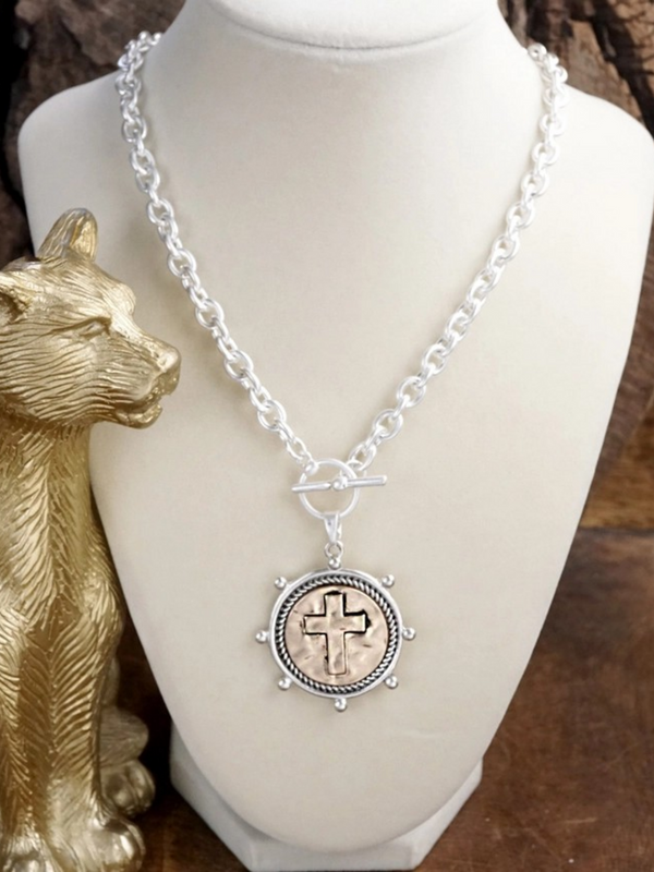 worn silver cross coin chain necklace with front toggle closure