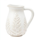 white pitcher with fern design