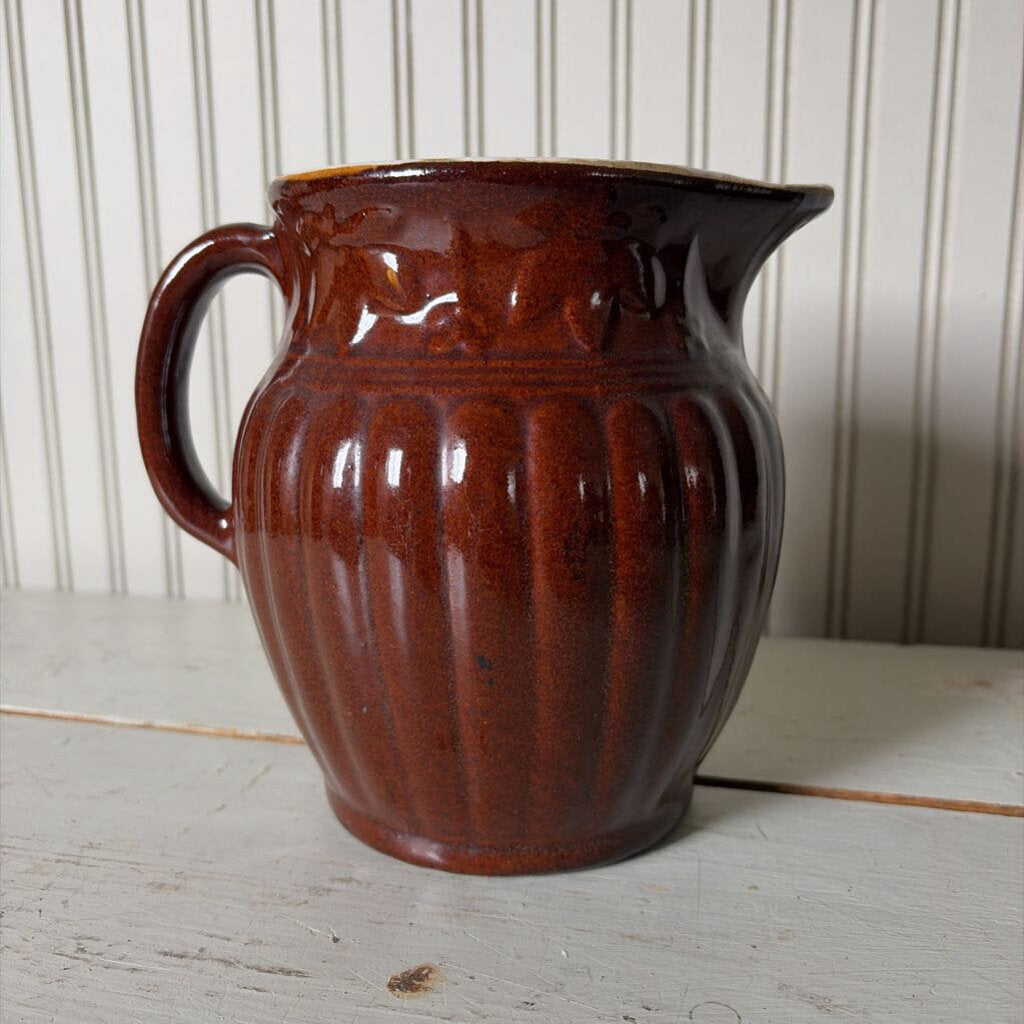 large brown pottery pitcher