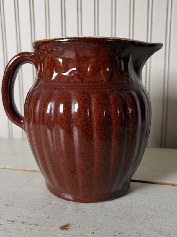 large brown pottery pitcher