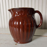 large brown pottery pitcher