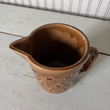 small brown pottery pitcher