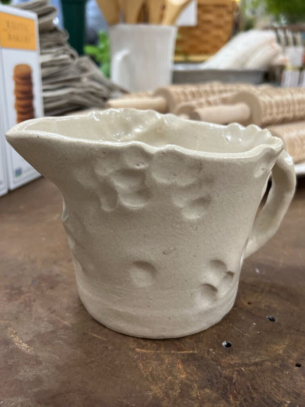 handmade clay pitcher with handle