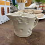handmade clay pitcher with handle