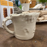handmade clay pitcher with handle