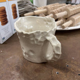 handmade clay pitcher with handle