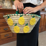 small straw bag with lemon detail