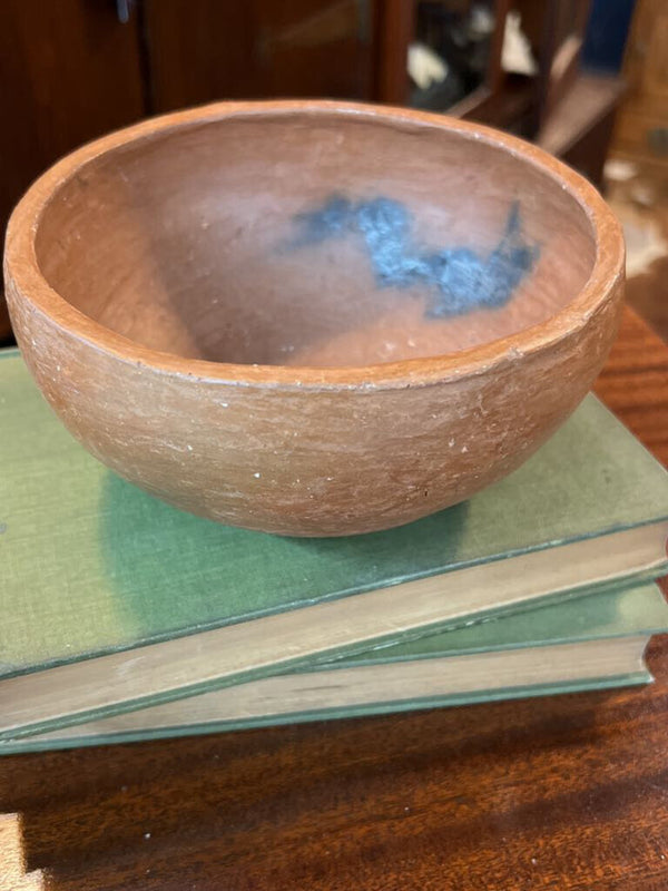 Handmade red clay pottery bowl with char