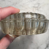 Hefty glass flower frog with edge