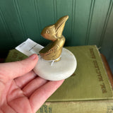 Brass Pelican on Circular Marble Slab