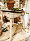 Chippy green and pink wooden stool