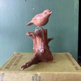 Wood Carved Bird on Tree Stump