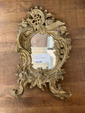 Ornate brass antique mirror