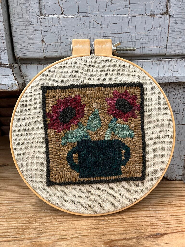 Wool needle work in hoop
