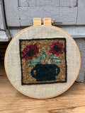 Wool needle work in hoop