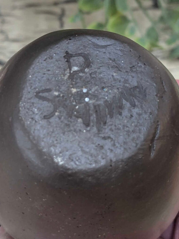 Signed Eastern Band Cherokee pottery, Swimmer family with original tag