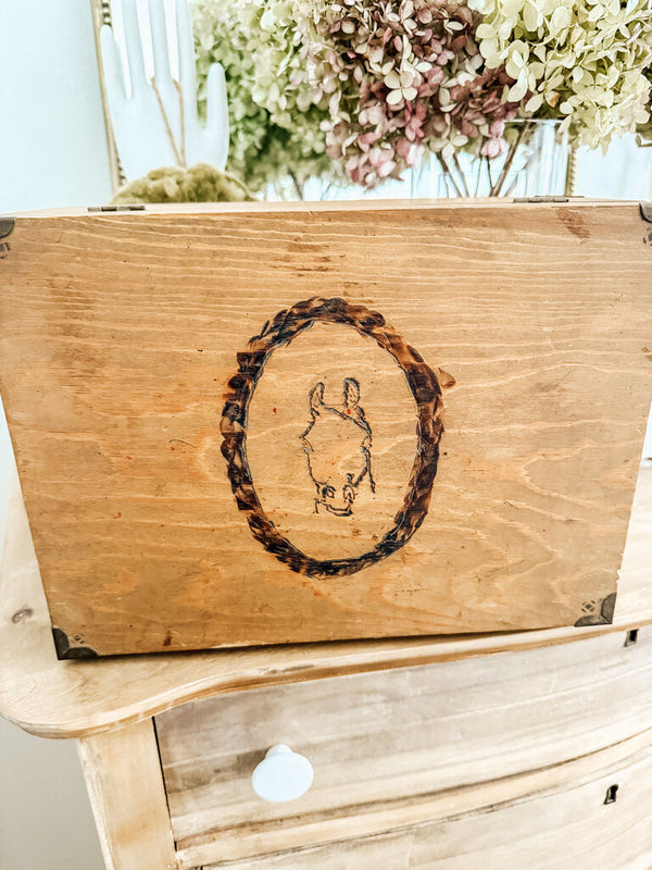 Wooden box with horse carving