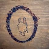 Wooden box with horse carving
