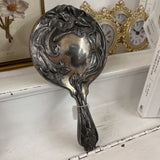 silver hand mirror