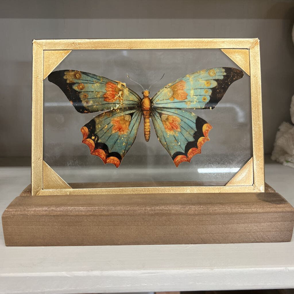 green butterfly glass and wood decor