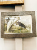 Gold framed herons
