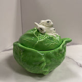 light green cabbage with rabbits atop