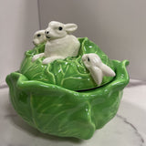 light green cabbage with rabbits atop