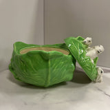 light green cabbage with rabbits atop