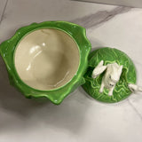light green cabbage with rabbits atop