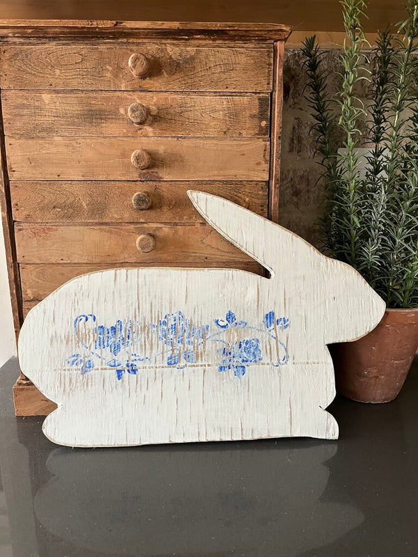Wood rabbit with blue flowers