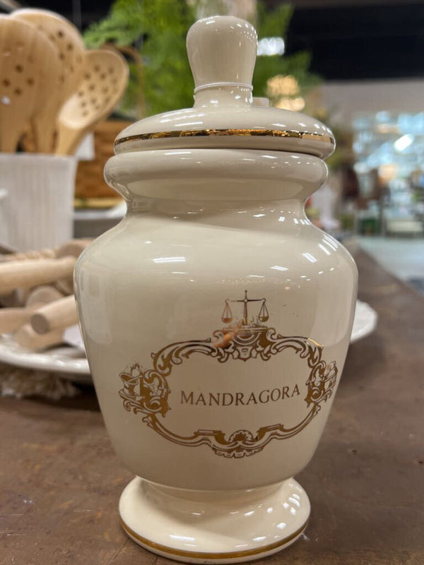 small white and gold urn with lid