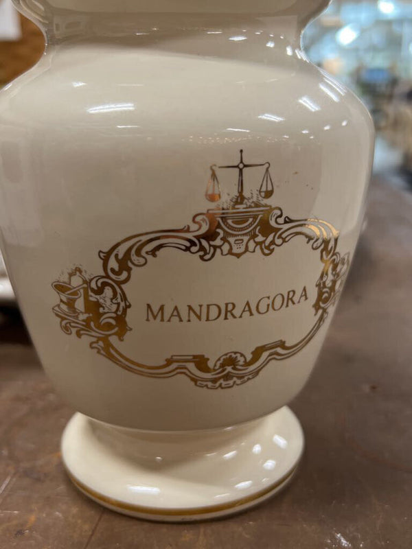 small white and gold urn with lid