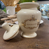 small white and gold urn with lid