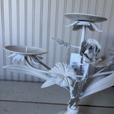 white metal triangle candle holder with metal flower