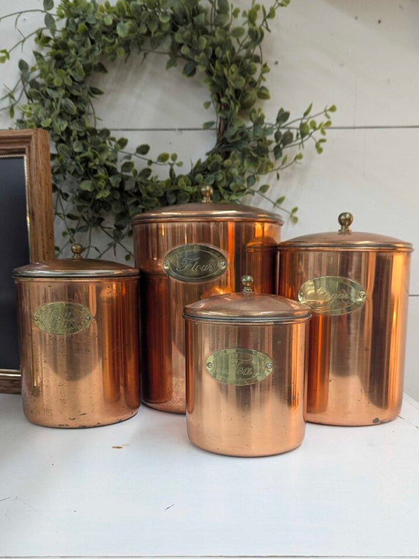 Set of 4 vintage nesting copper canisters