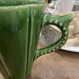 green ribbed pottery pitcher