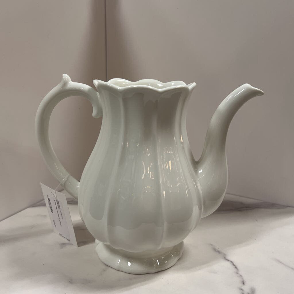 white ribbed pottery pitcher