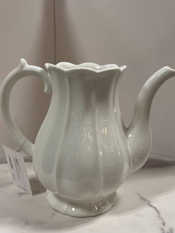 white ribbed pottery pitcher