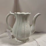 white ribbed pottery pitcher