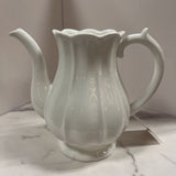 white ribbed pottery pitcher