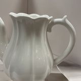 white ribbed pottery pitcher