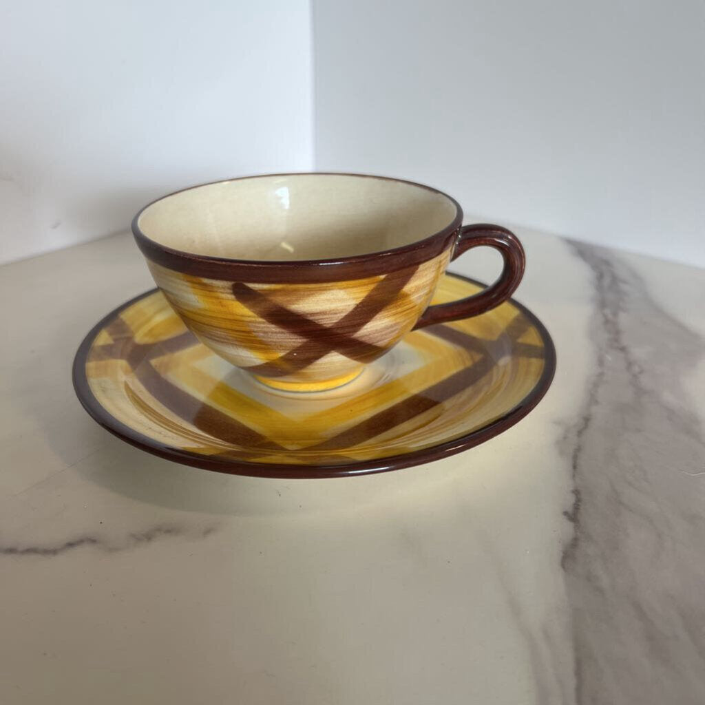 brown and yellow plaid cup and saucer set