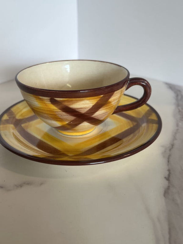 brown and yellow plaid cup and saucer set