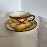 brown and yellow plaid cup and saucer set