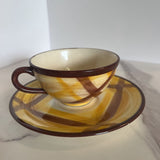 brown and yellow plaid cup and saucer set