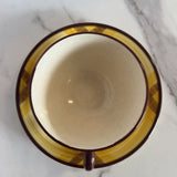 brown and yellow plaid cup and saucer set